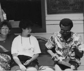 man holding his art work