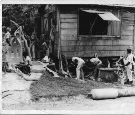 men digging around the house